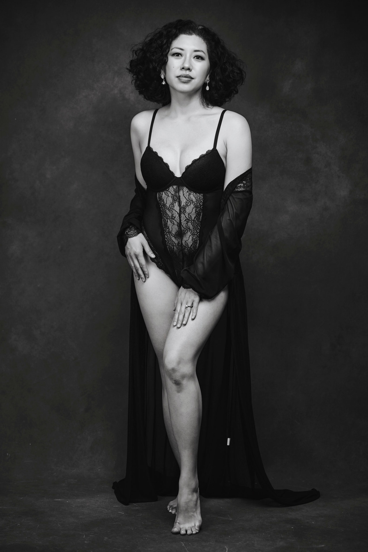 Black-and-white standing boudoir portrait in black robe